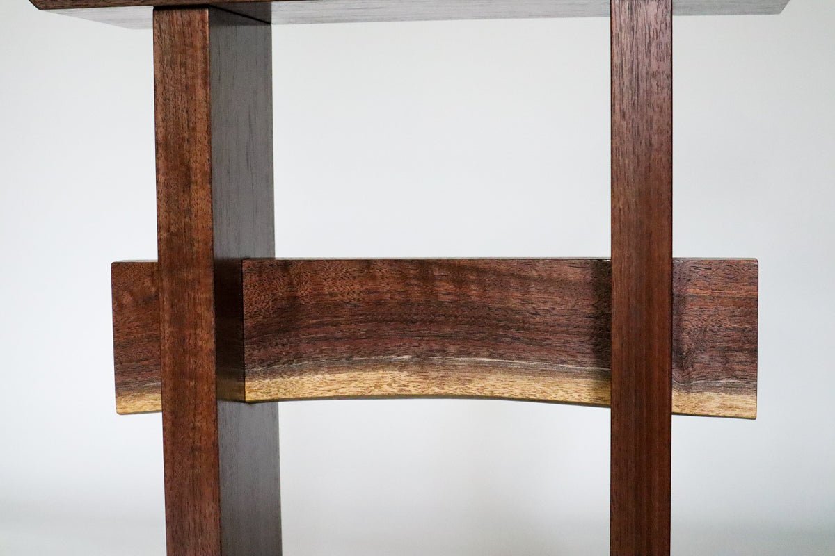 Beautiful colors and grain patterns featured on the live edge stretcher of our Statement End Table. From Mokuzai Furniture.
