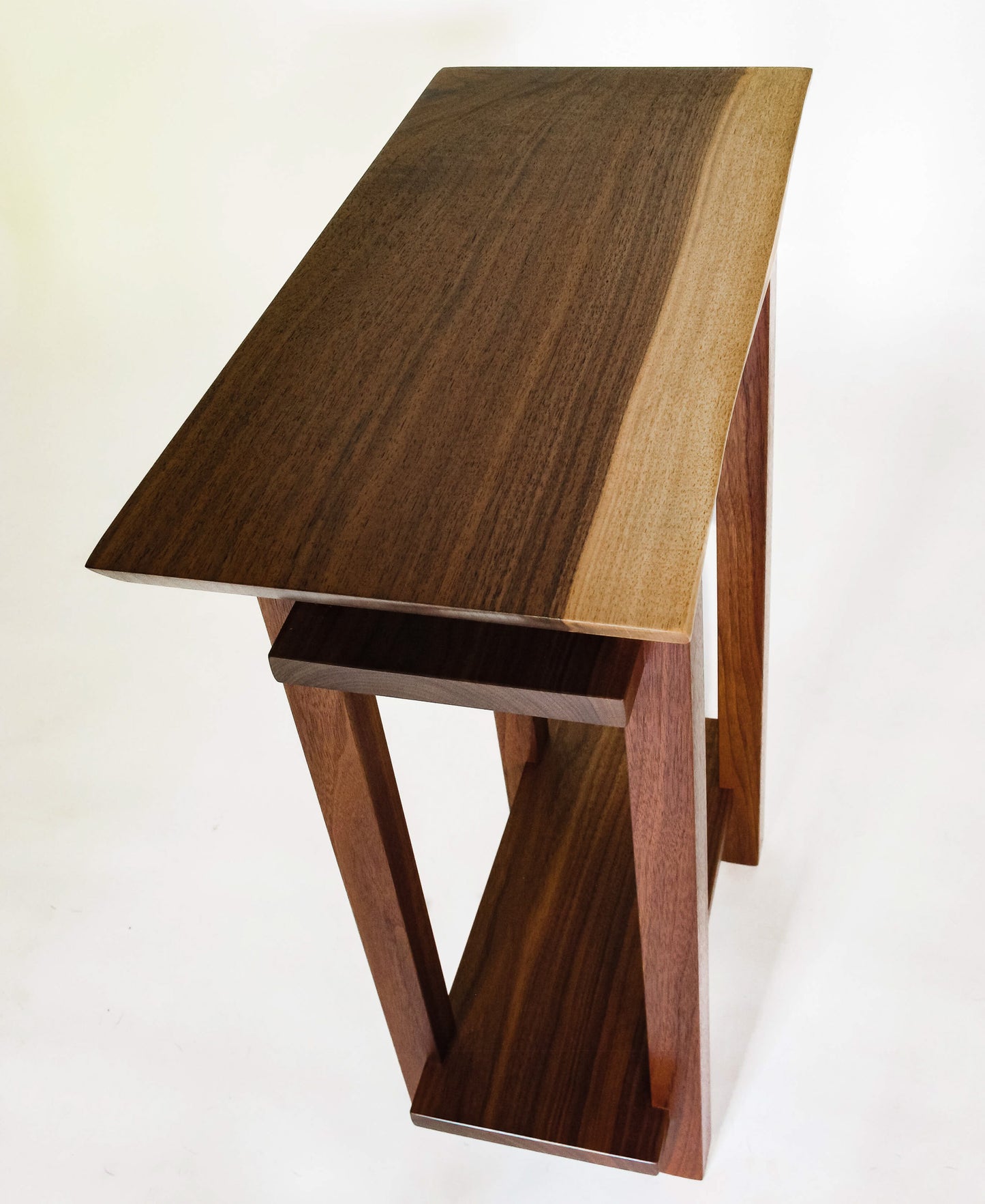 A modern end table with live edge tabletop, narrow for small spaces from Mokuzai Furniture.