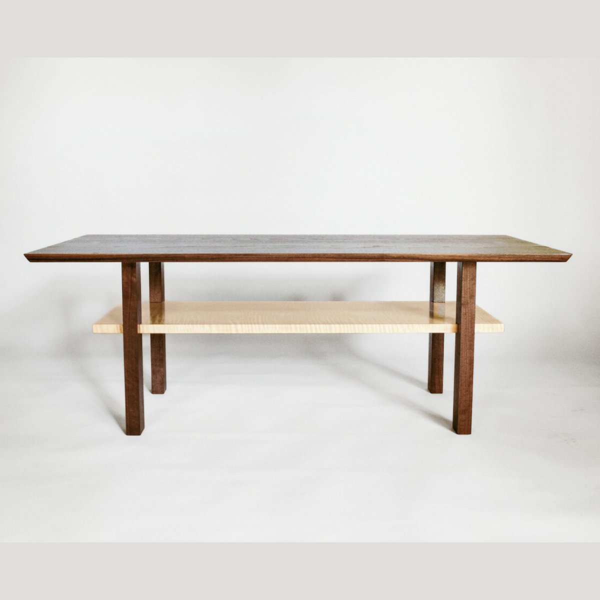 A modern wood coffee table by Mokuzai Furniture.