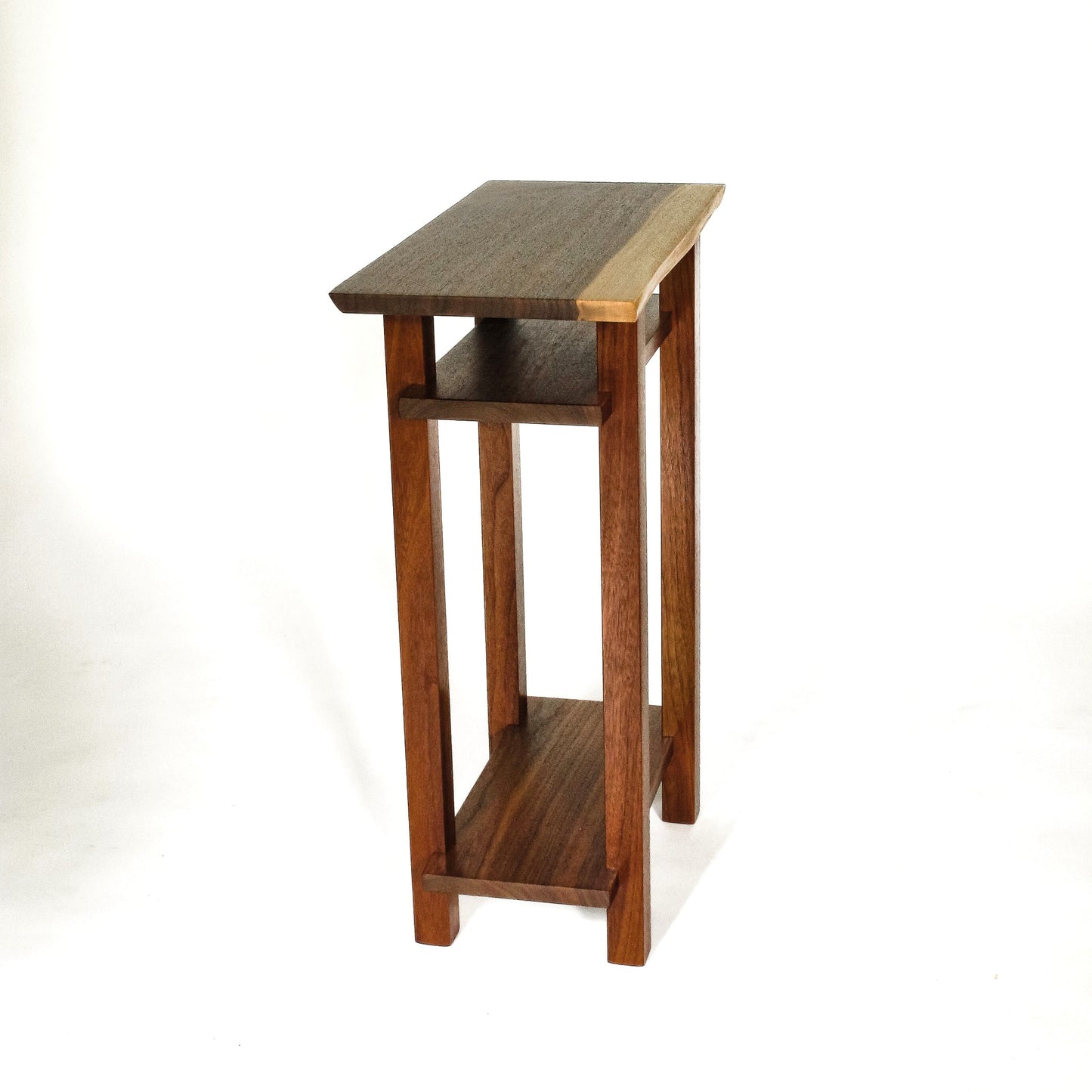 A narrow end table with shelves from Mokuzai Furniture.