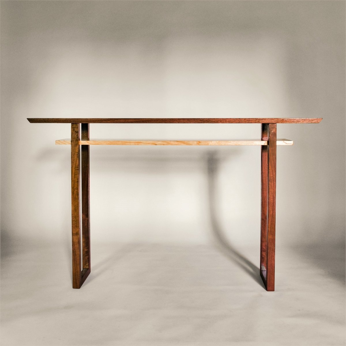Modern wood console table in traditional wood tones of walnut and cherry