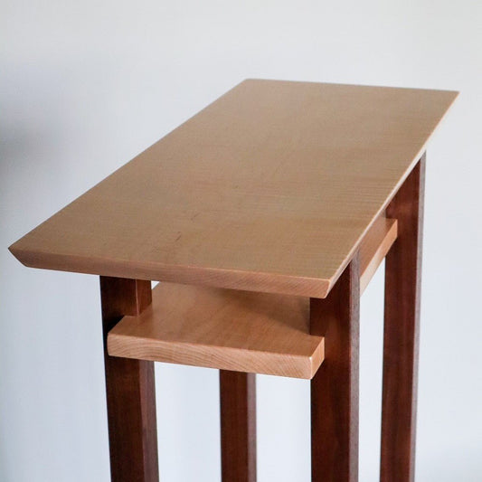 A small custom end table in tiger maple and walnut by Mokuzai Furniture.  Our modern wood end tables are narrow for small space solutions
