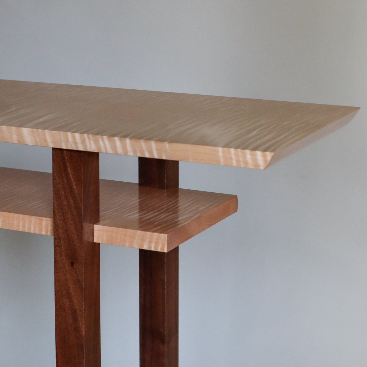 This is a mid-century modern console table made by Mokuzai Furniture.