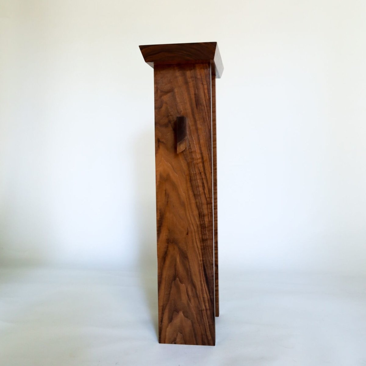a narrow entry table in solid walnut by Mokuzai Furniture