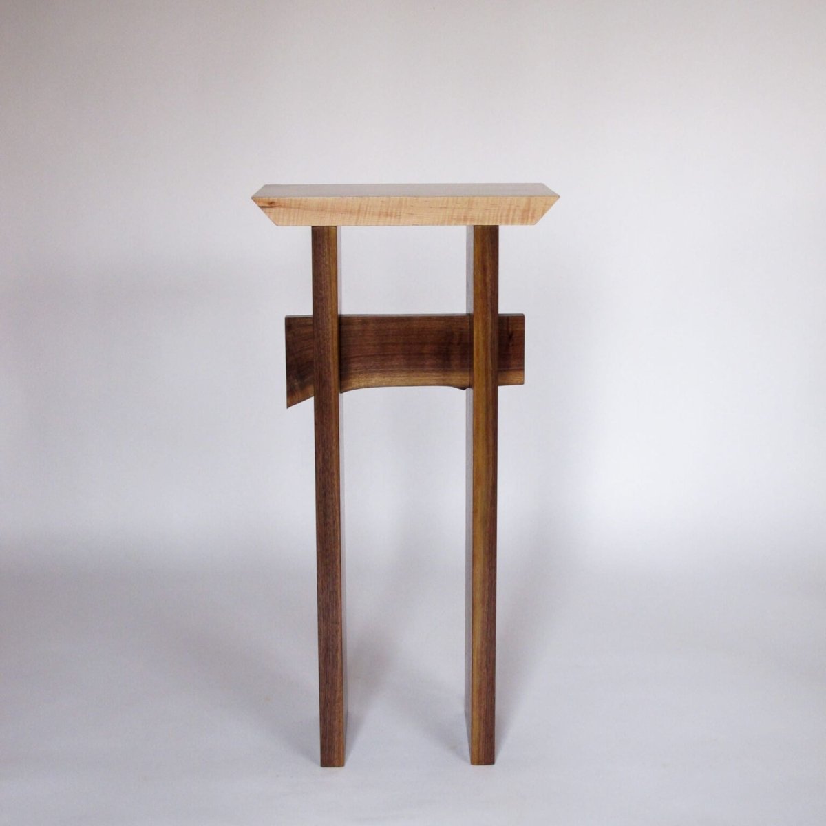 a small entry table that is tall and is a solid wood entry table by Mokuzai Furniture