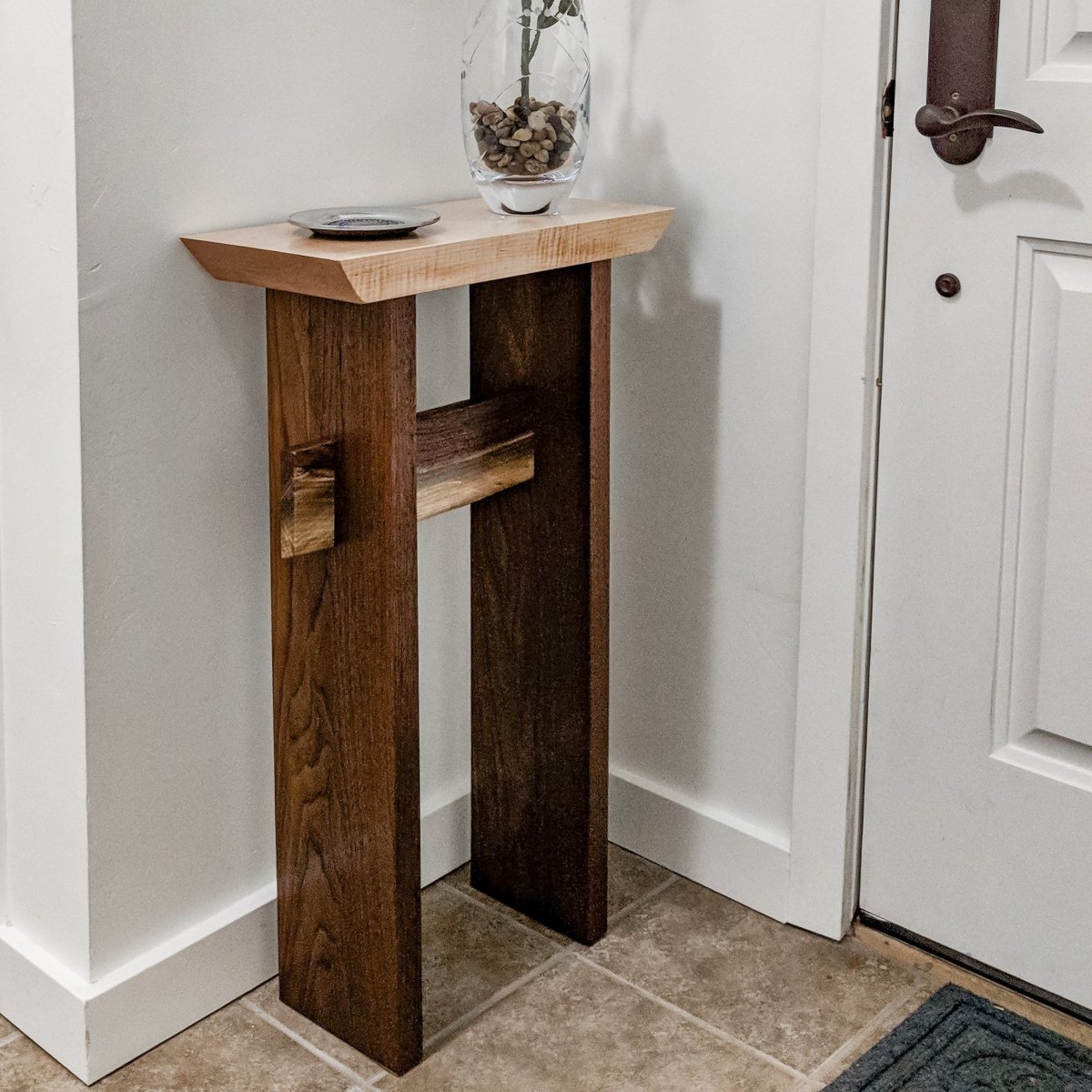 A small entryway table with Japanese-inspired style that celebrates the natural beauty of wood from Mokuzai Furniture.