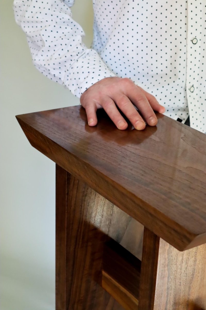 A flawless, hand-rubbed finish enhances the rich beauty of the walnut wood on our Statement Small Entryway Table.