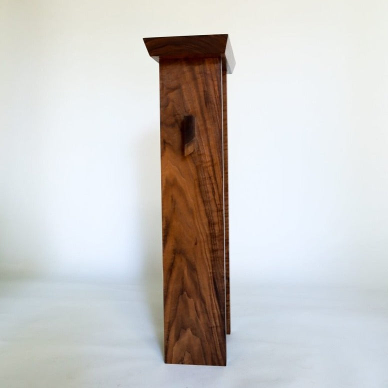 A small narrow entryway table created from solid walnut by Mokuzai Furniture.