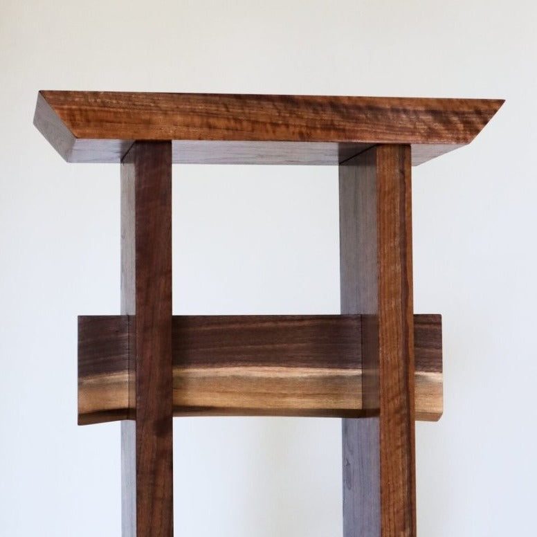 A narrow entryway table for small spaces handmade from beautiful solid walnut by Mokuzai Furniture.
