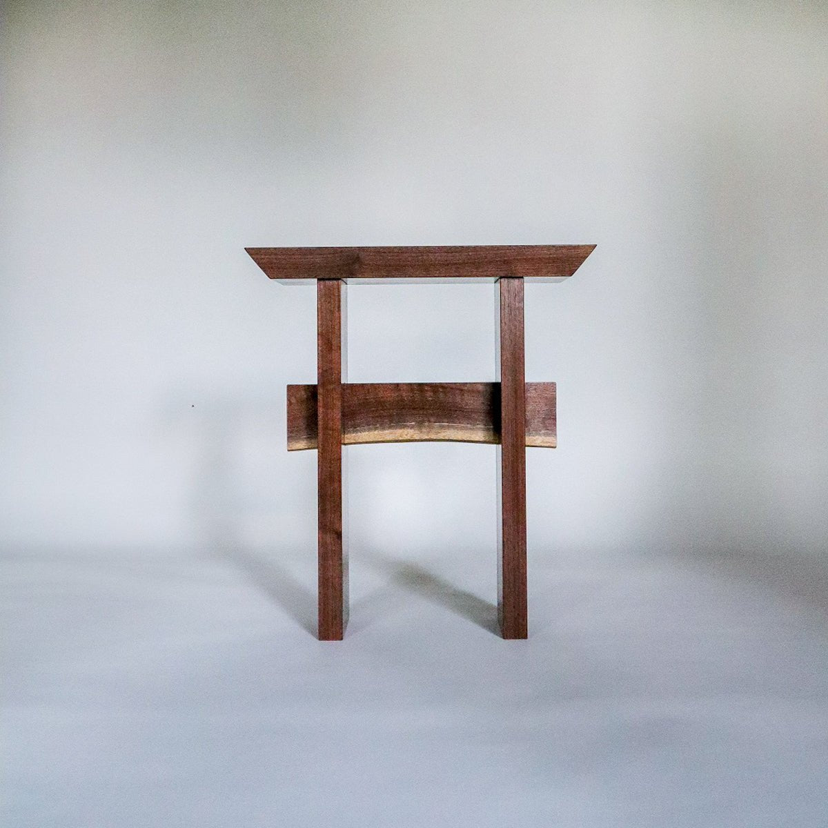 The Statement End Table is a small living room table hand-crafted by Mokuzai Furniture.