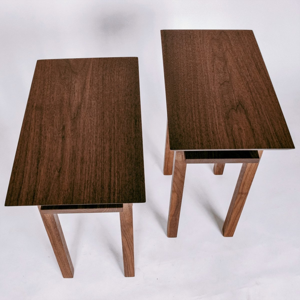 Solid walnut end tables that are thin for small spaces from Mokuzai Furniture.