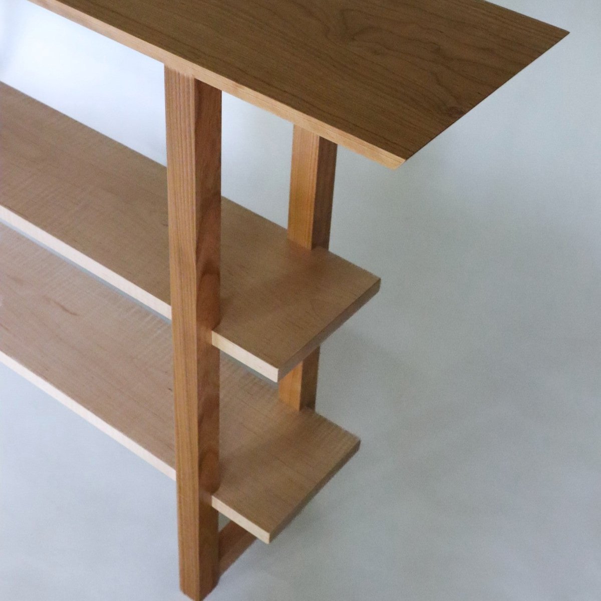 modern console table cherry with tiger maple shelves.