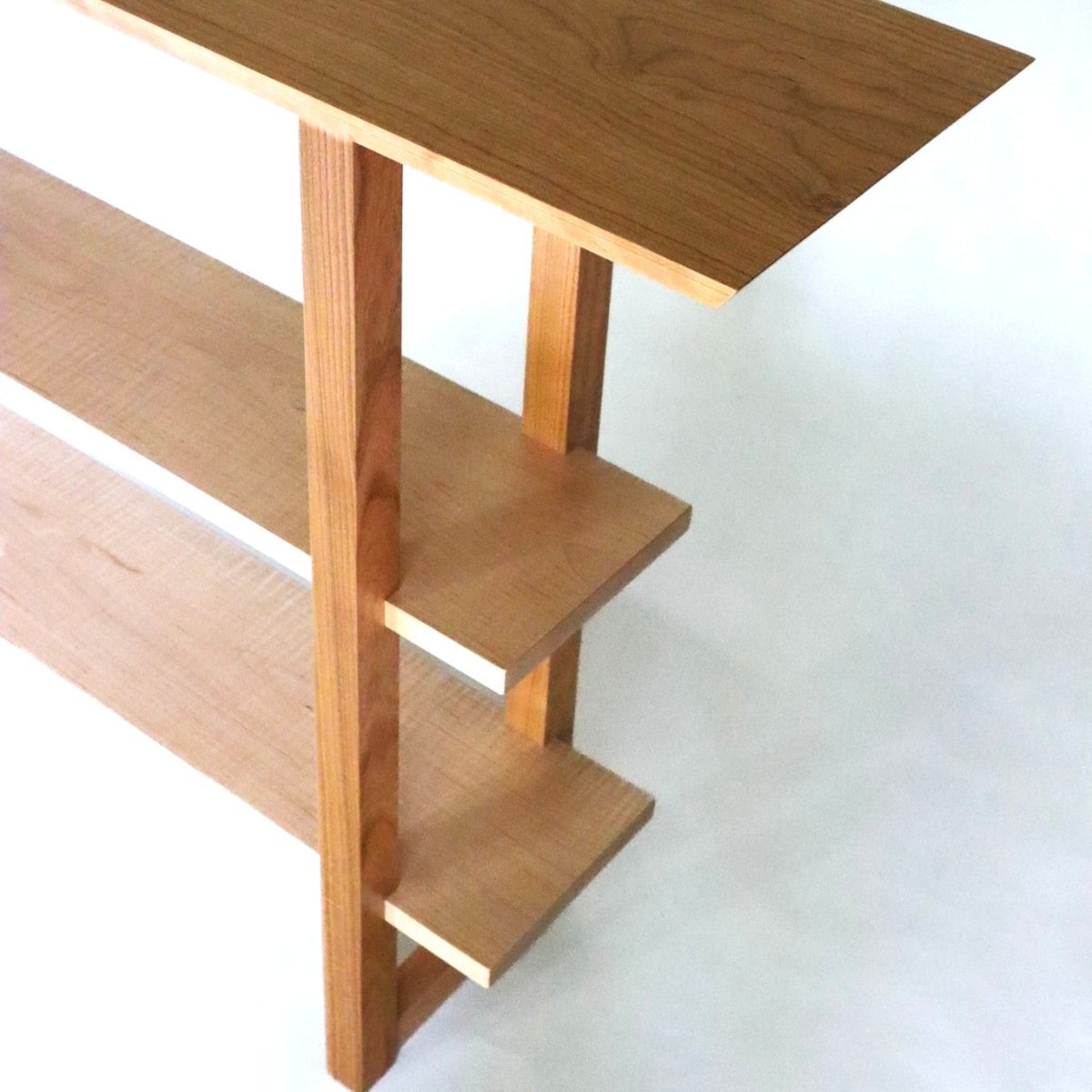 A cherry console table with maple shelves for entryways and dining rooms or a table behind the sofa from Mokuzai Furniture.