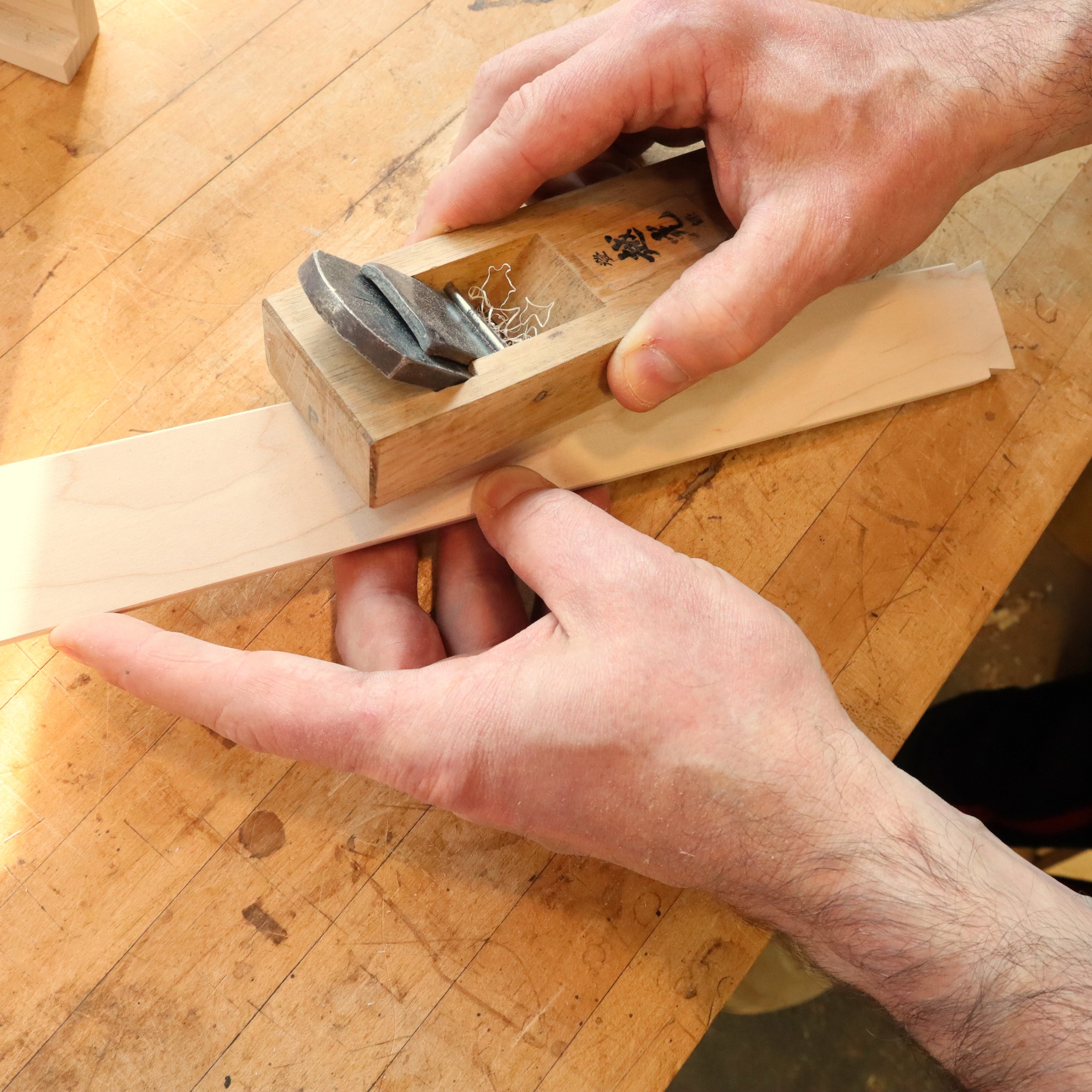 detailing pieces of an end table with drawer at Mokuzai Furniture