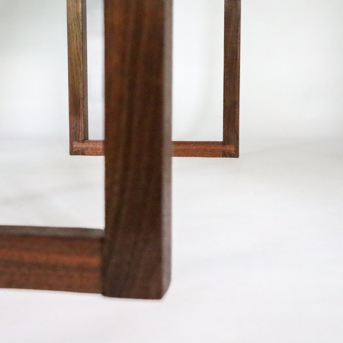 Dovetail details for the feet of a handmade tv console table from Mokuzai Furniture.