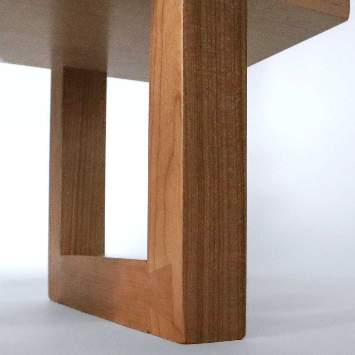 A handmade modern wood console table narrow for hallways, with unique dovetail feet details from Mokuzai Furniture.
