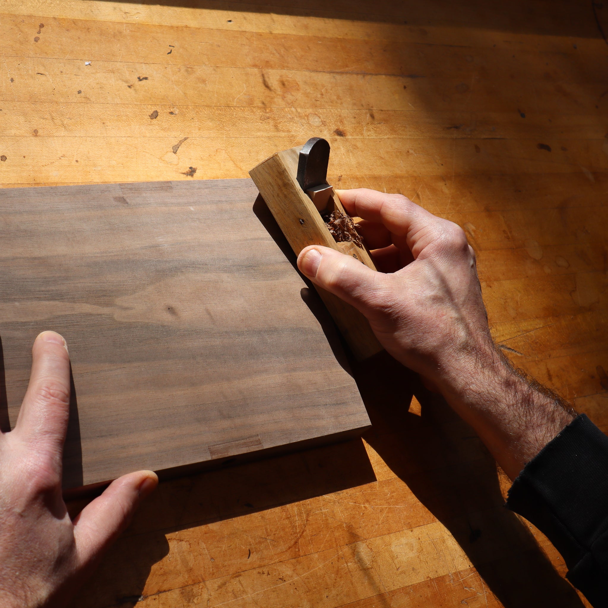 a traditional Japanese block plane is used to shaped the ends of the shelf for a hall table by Mokuzai Furniture