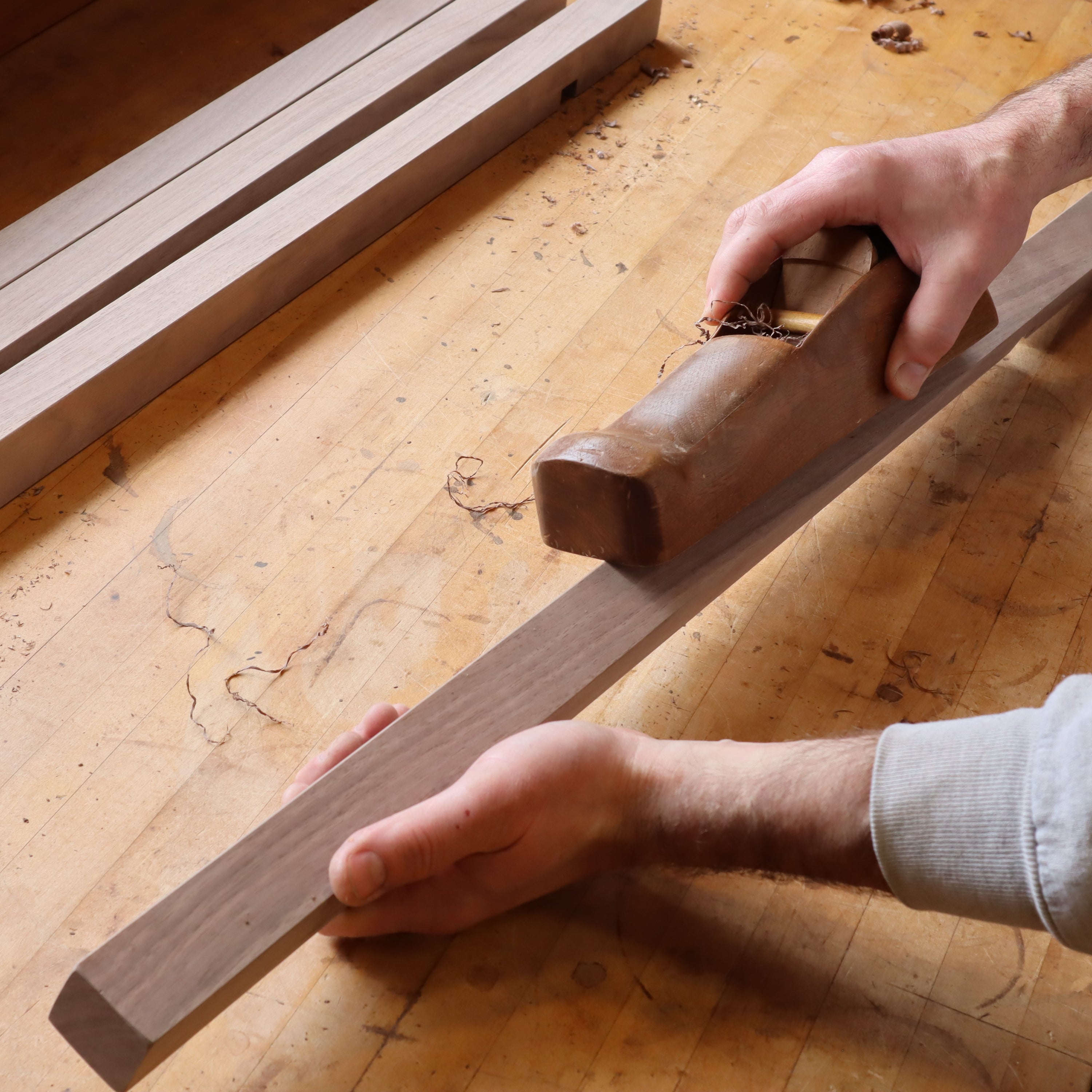 handplaning table legs for a long console table at Mokuzai Furniture