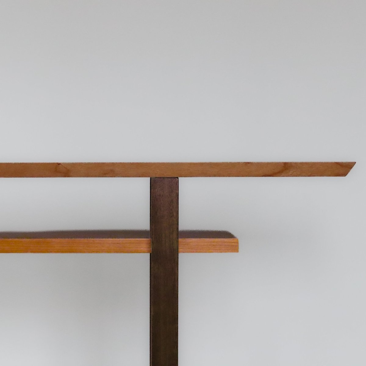 Minimalist narrow console table with shelf by Mokuzai Furniture.