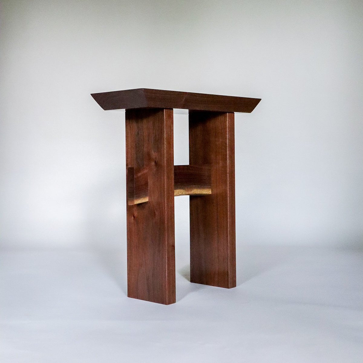 A modern end table design for small spaces by Mokuzai Furniture.