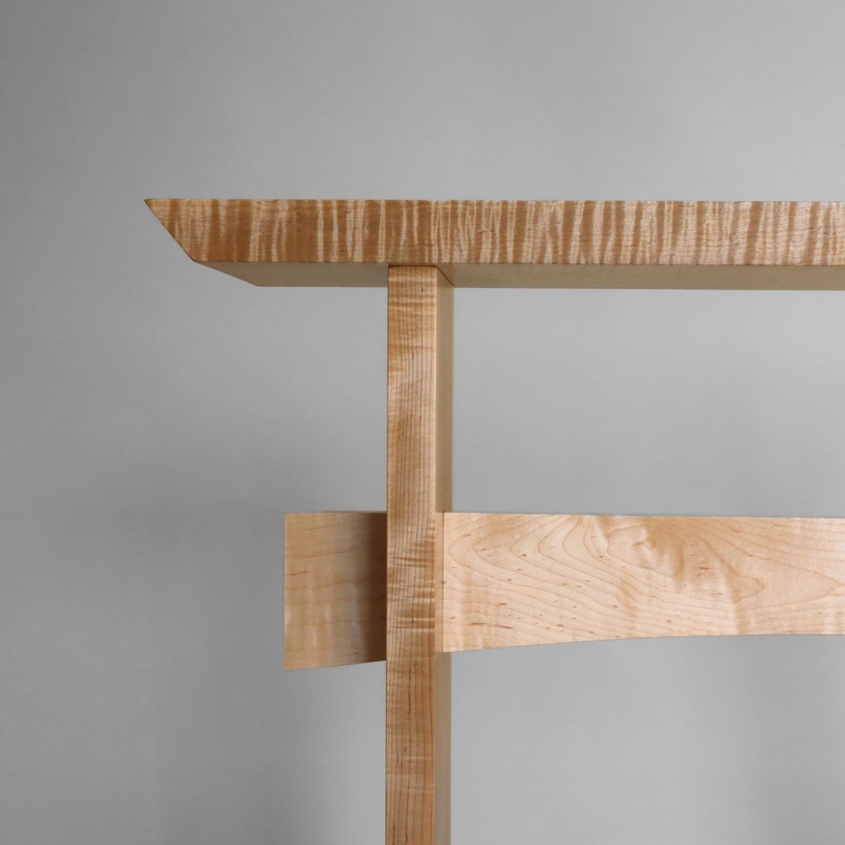 Modern narrow side table in solid tiger maple by Mokuzai Furniture.