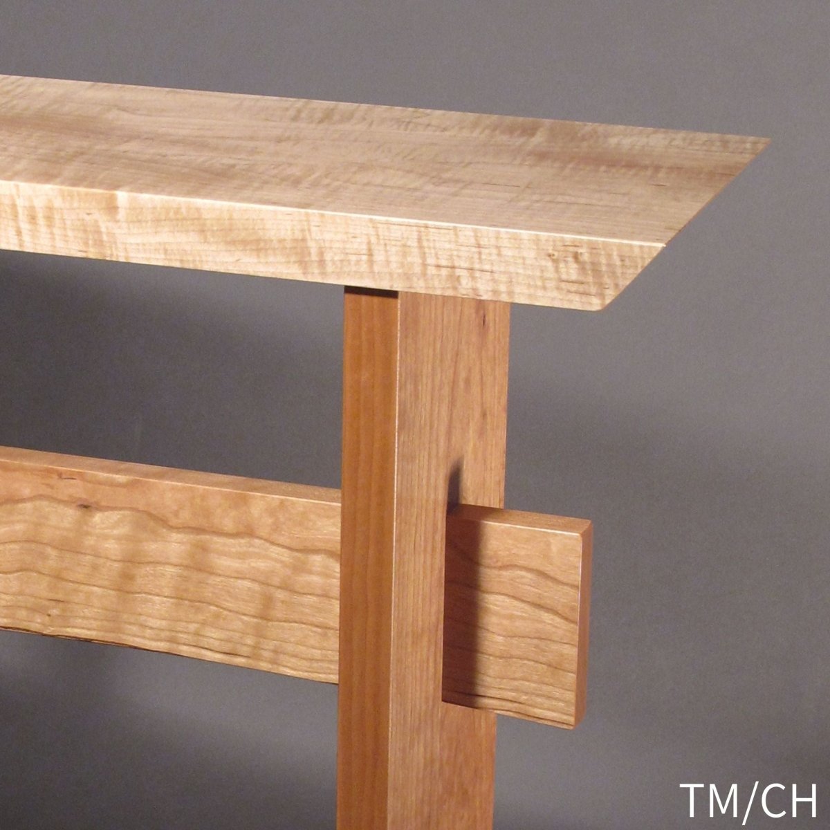 The combination of tiger maple and cherry woods for a custom end table by Mokuzai Furniture.