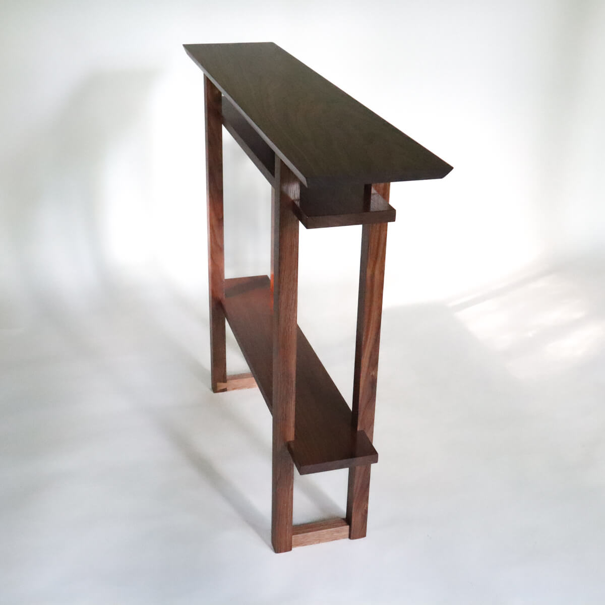 a narrow hall table with shelves for display, handmade wood furniture design by Mokuzai Furniture
