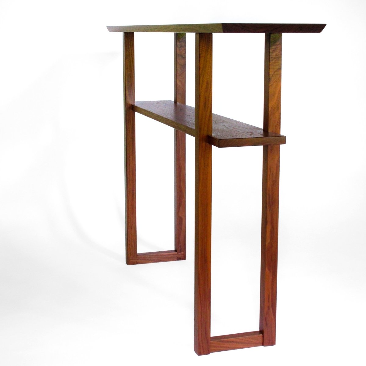 A narrow walnut sofa table or entry table from Mokuzai Furniture.