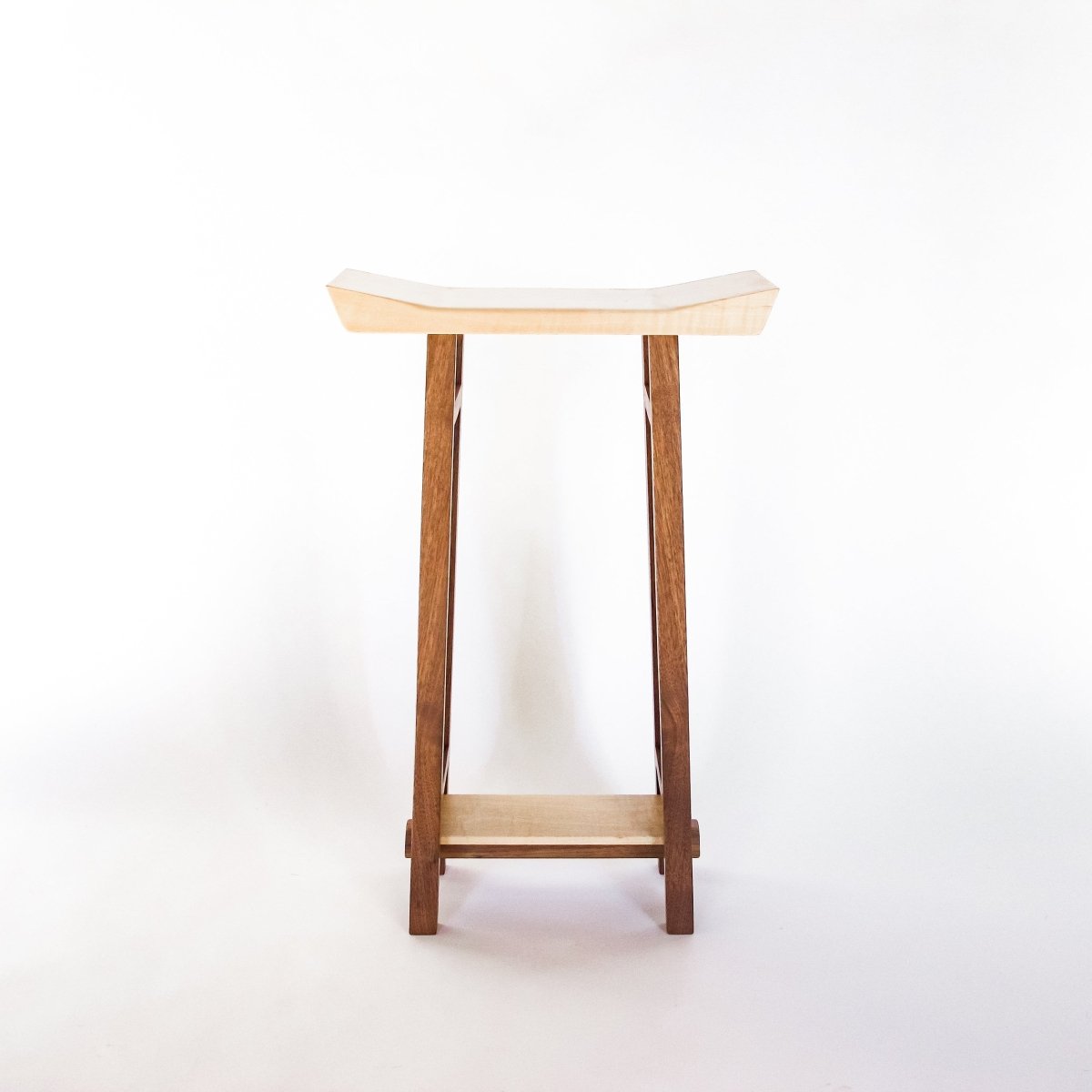 A bedside table or narrow nightstand by Mokuzai Furniture.