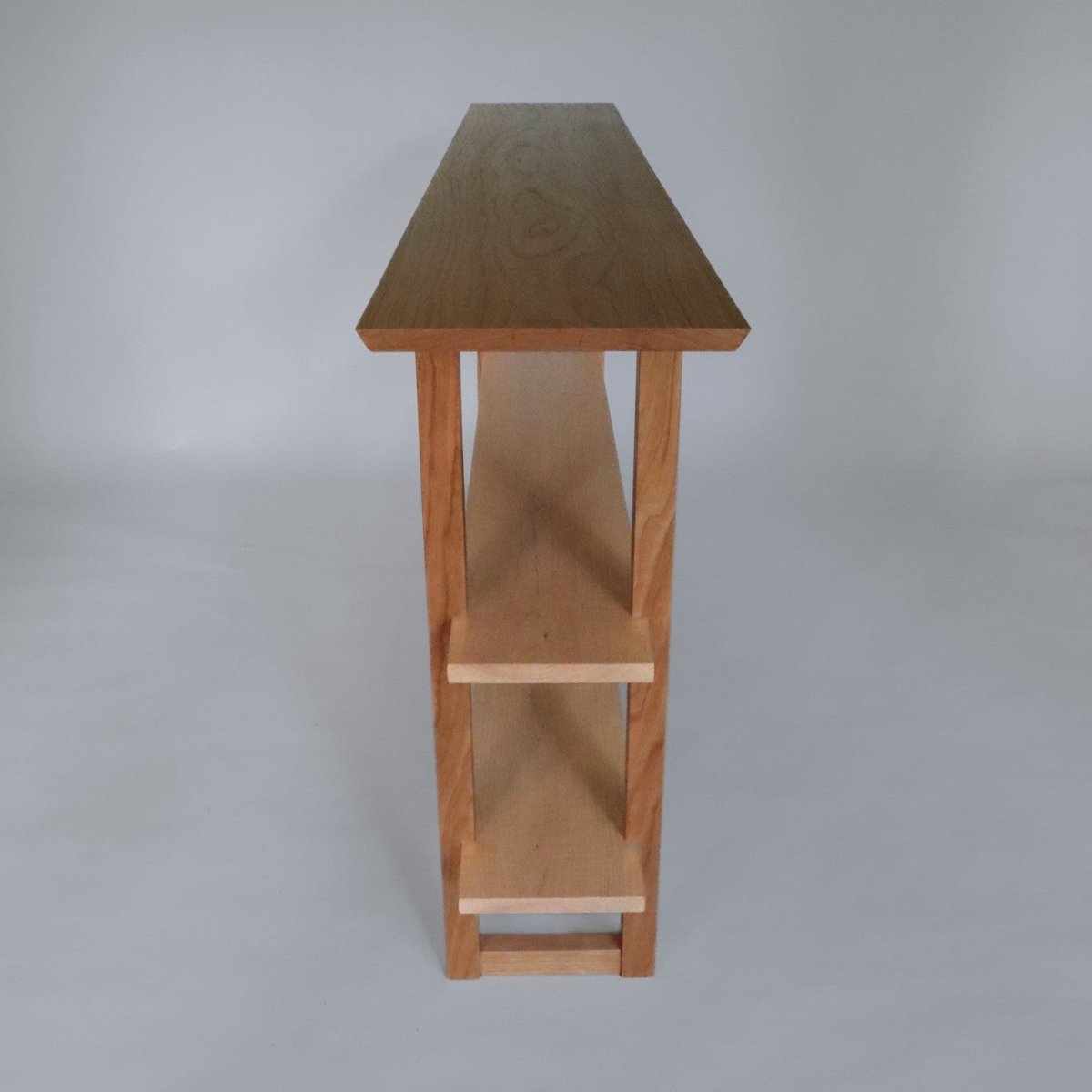 skinny console table with shelves by Mokuzai Furniture.