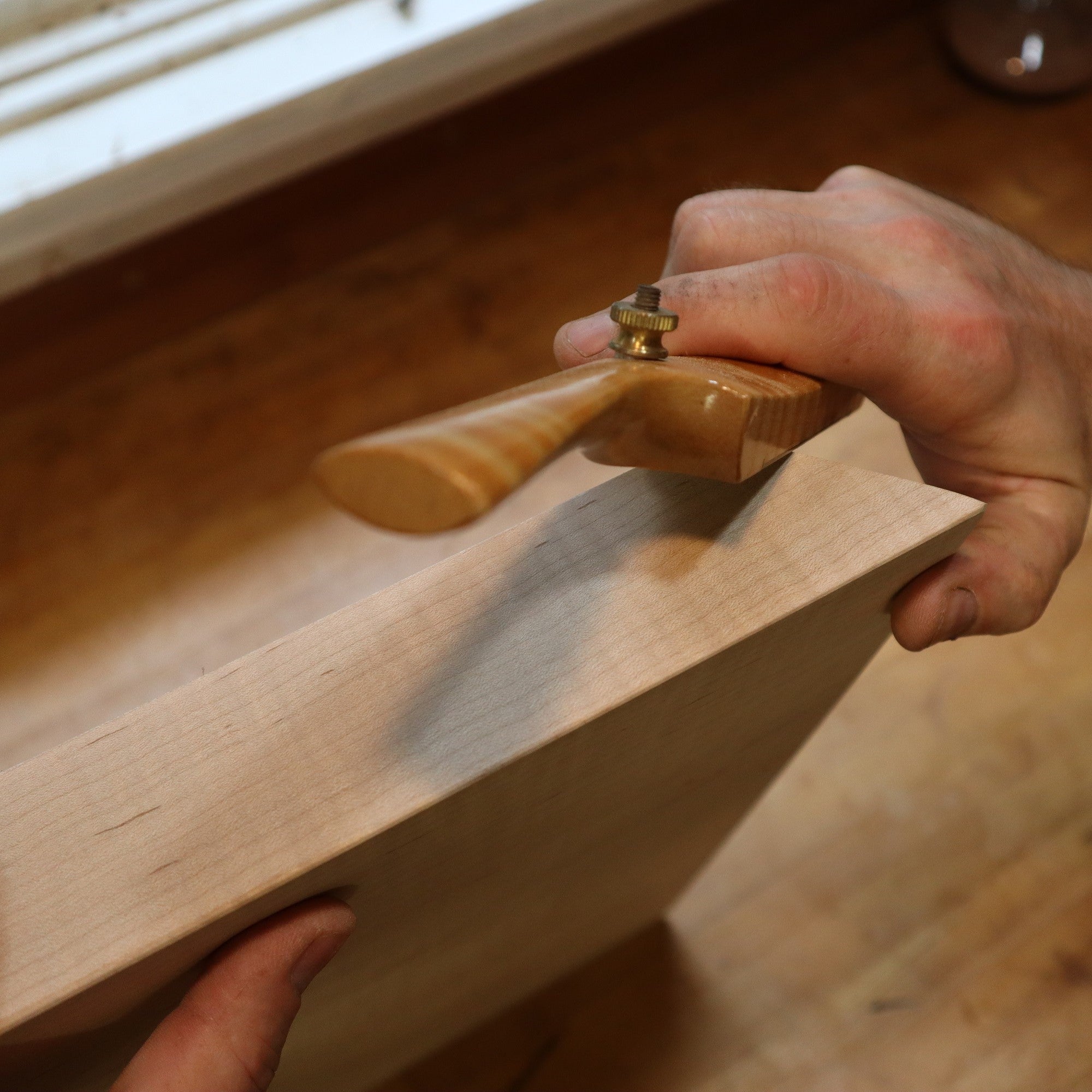 the corner details of a modern zen side table are created with a spokeshave at Mokuzai Furniture