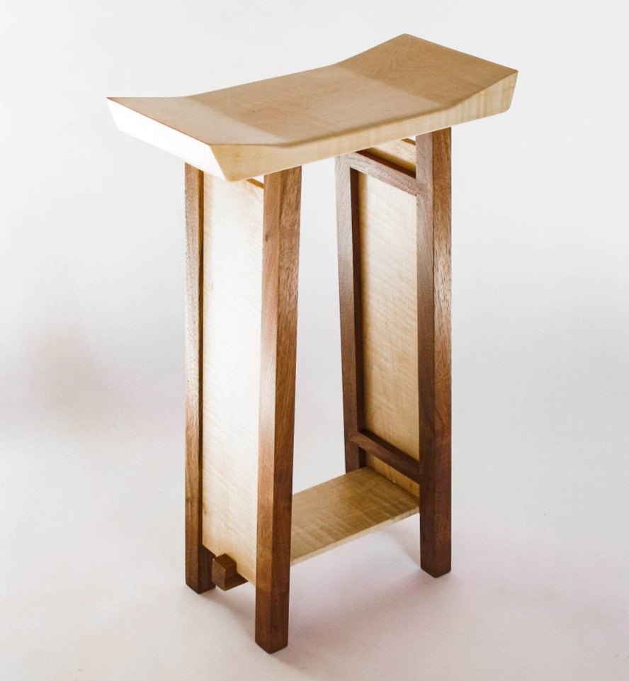 a narrow bed side table in tiger maple and walnut by Mokuzai Furniture