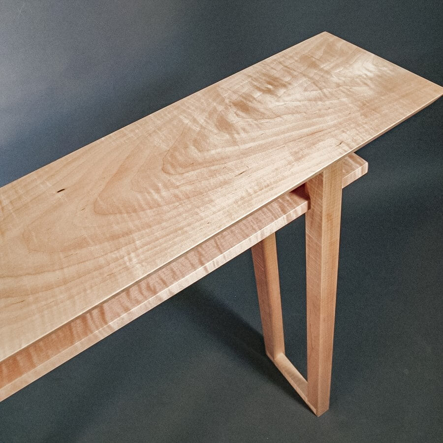 A unique tiger maple console table for entryways handcrafted by Mokuzai Furniture.
