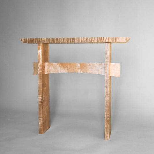 A tiger maple narrow side table for entryways by Mokuzai Furniture.
