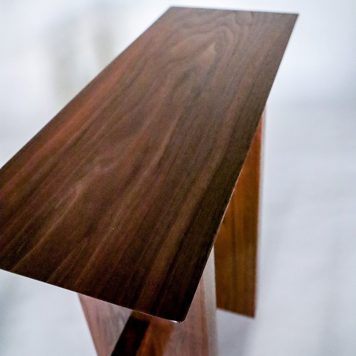 A solid walnut small end table from Mokuzai Furniture.