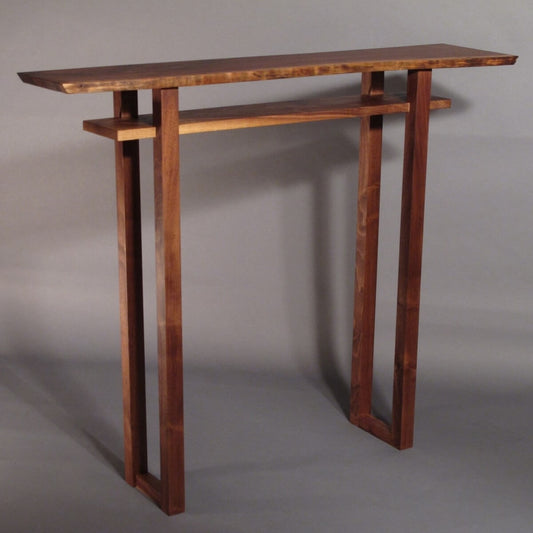 a console table for hallways with a live edge walnut table top by Mokuzai Furniture