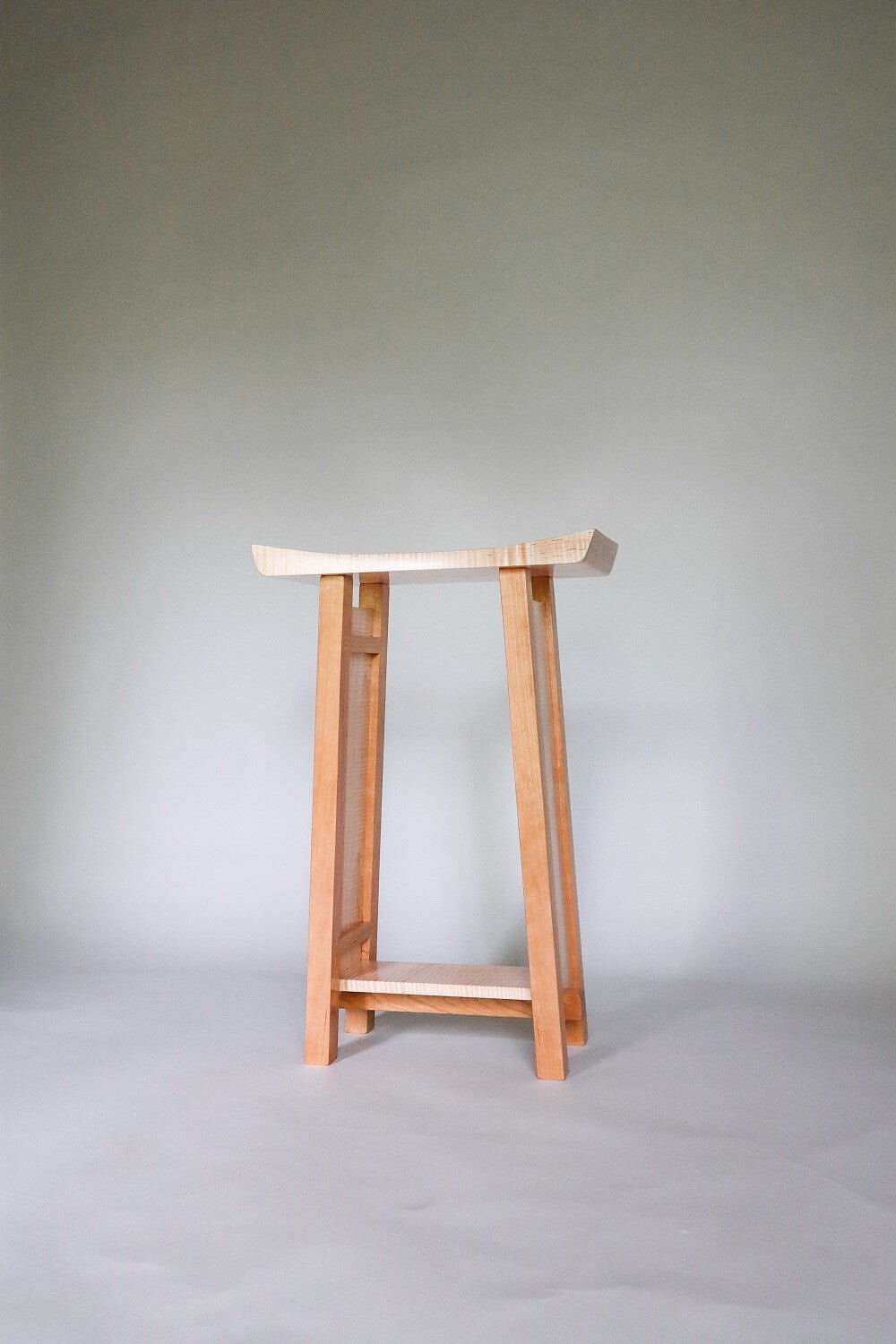 An artistic side table with a unique shape and narrow size - modern furniture designs by Mokuzai Furniture