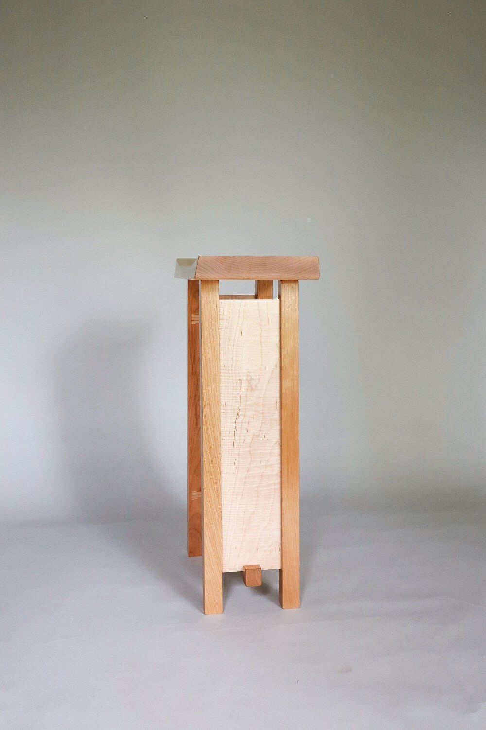 A narrow side table handmade from tiger maple and cherry - modern wood furniture by Mokuzai Furniture