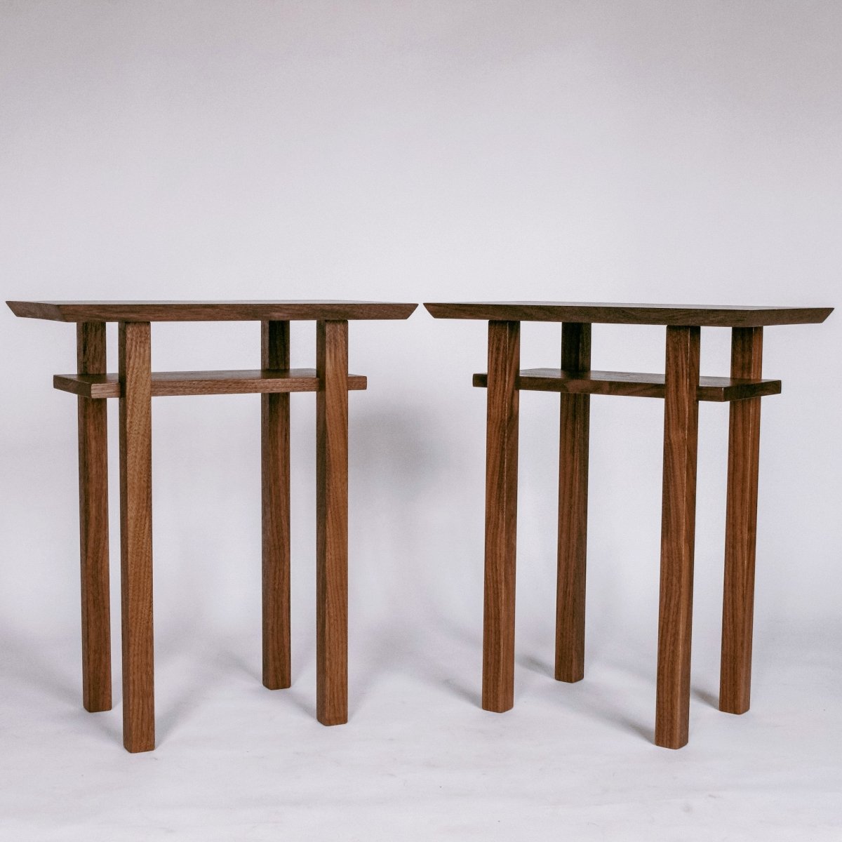 a pair of small end tables handmade from solid walnut