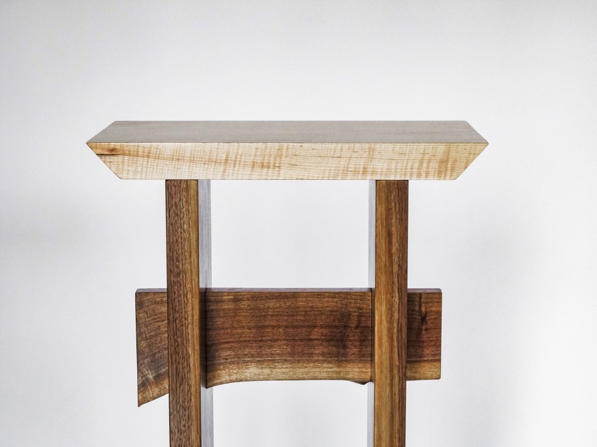 A small narrow table with live edge walnut