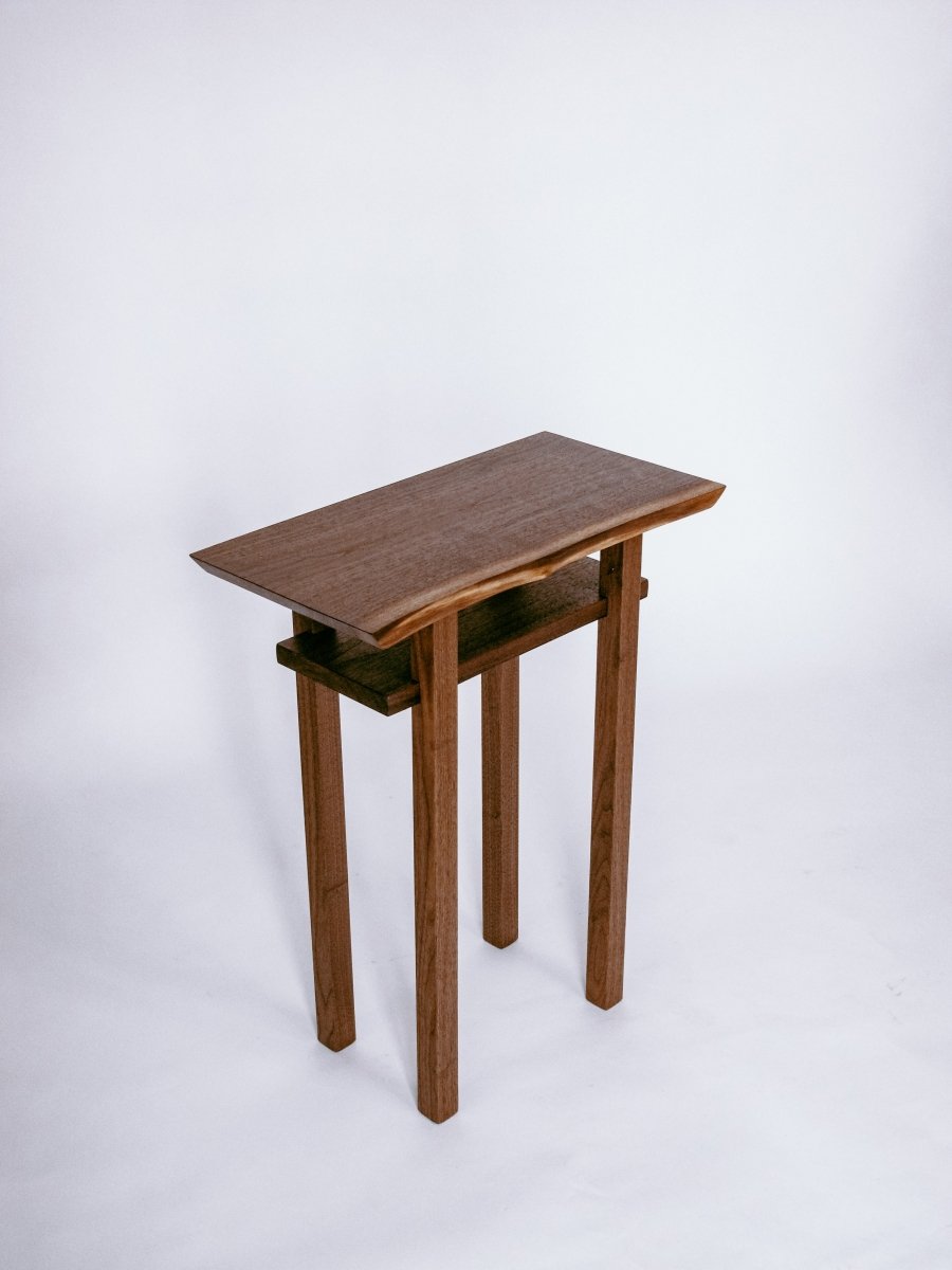 small narrow end table in solid walnut with live edge slab top