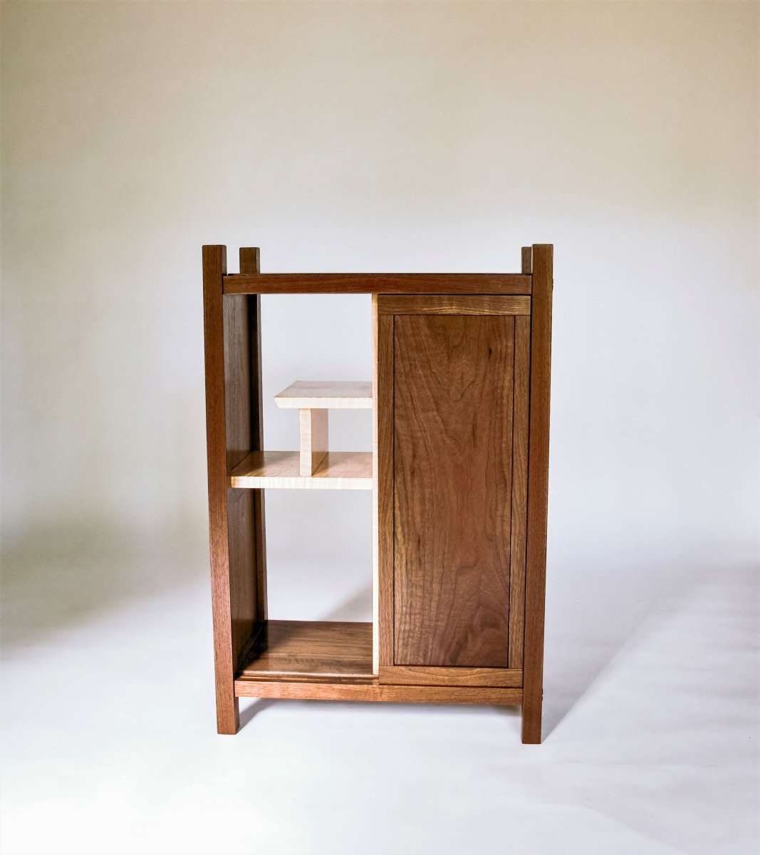 Walnut bar cabinet with sliding door and display shelving