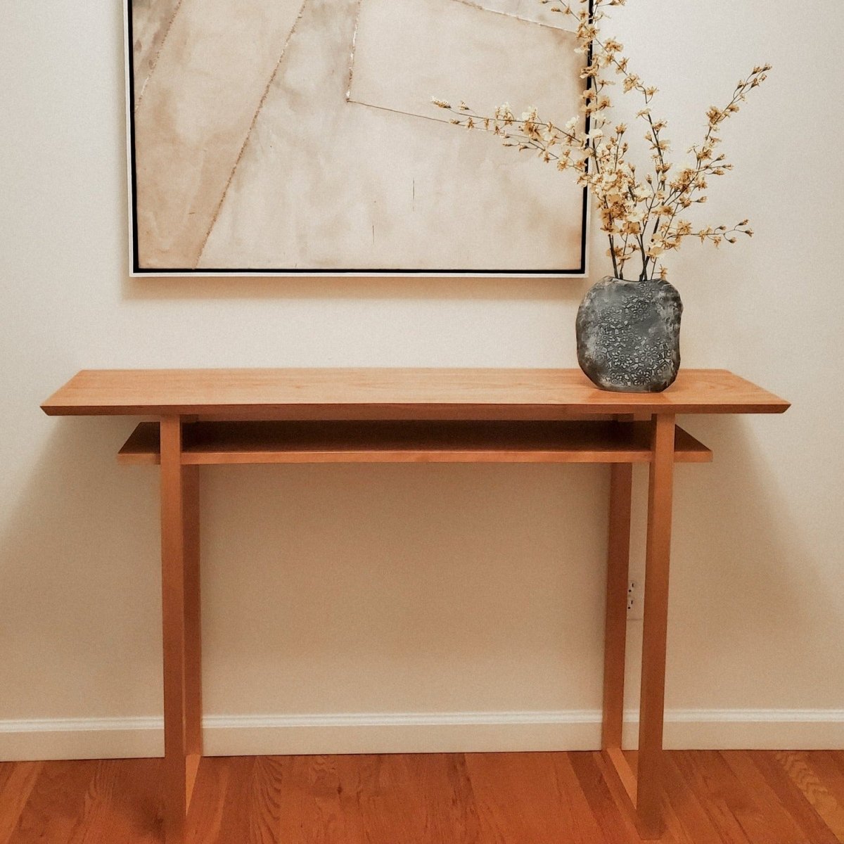 A contemporary cherry console table for entryways by Mokuzai Furniture.