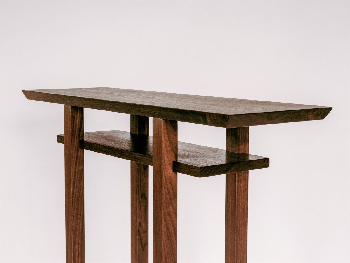 A minimalist tall entry table narrow in size by Mokuzai Furniture.
