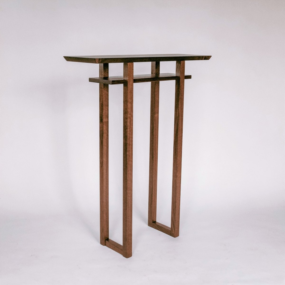 A tall narrow console table for entryways by Mokuzai Furniture.