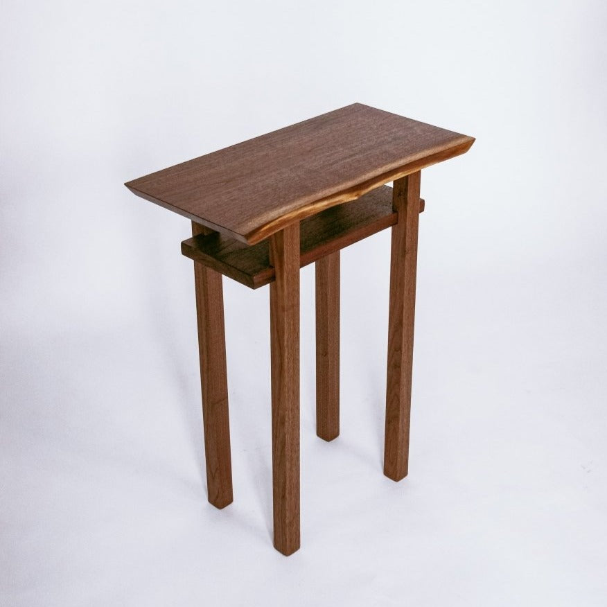 A narrow end table with shelf - live edge walnut table