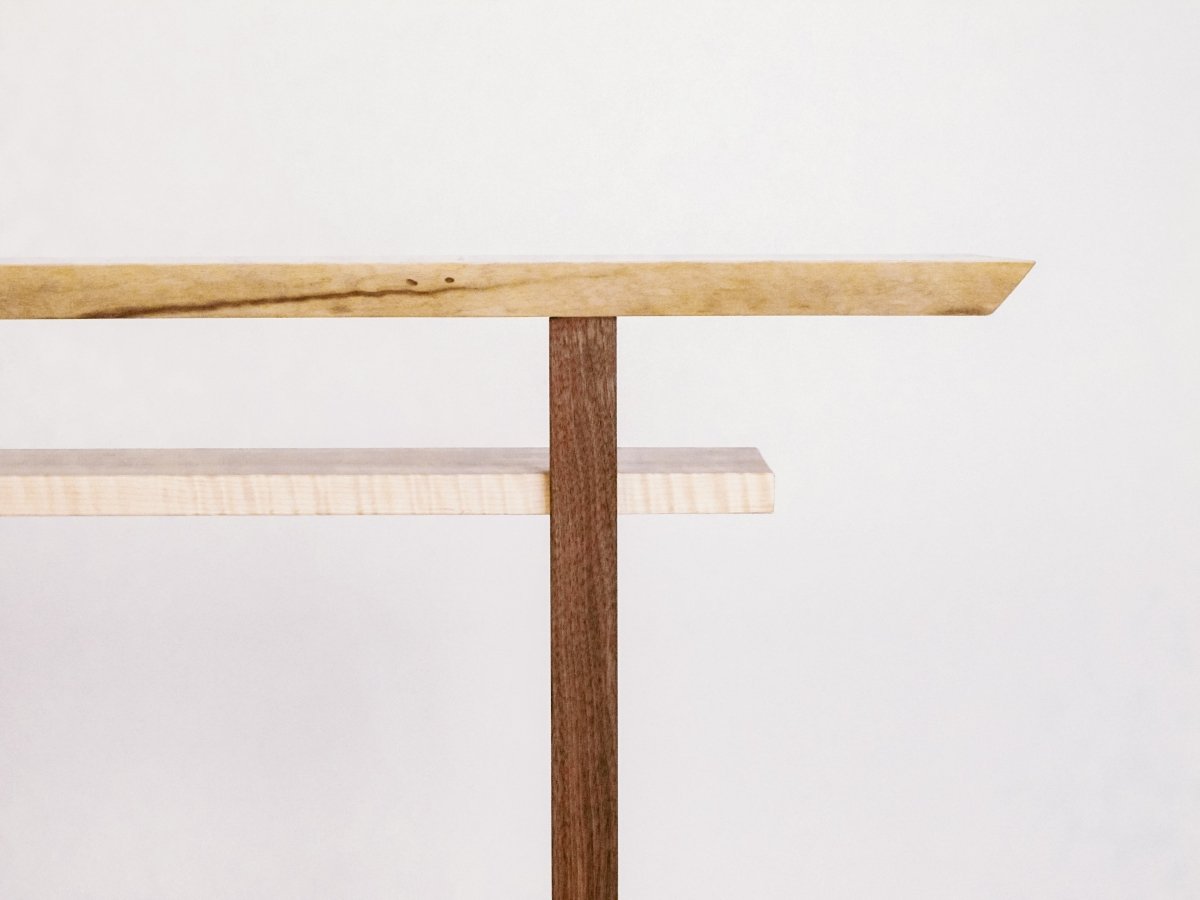 Live edge walnut table top, walnut table legs and tiger maple shelf for this modern wood console table by Mokuzai Furniture