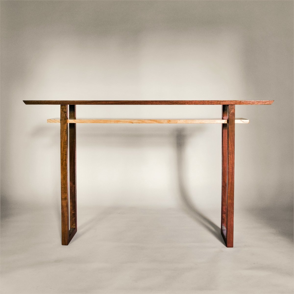 Modern wood console table in traditional wood tones of walnut and cherry