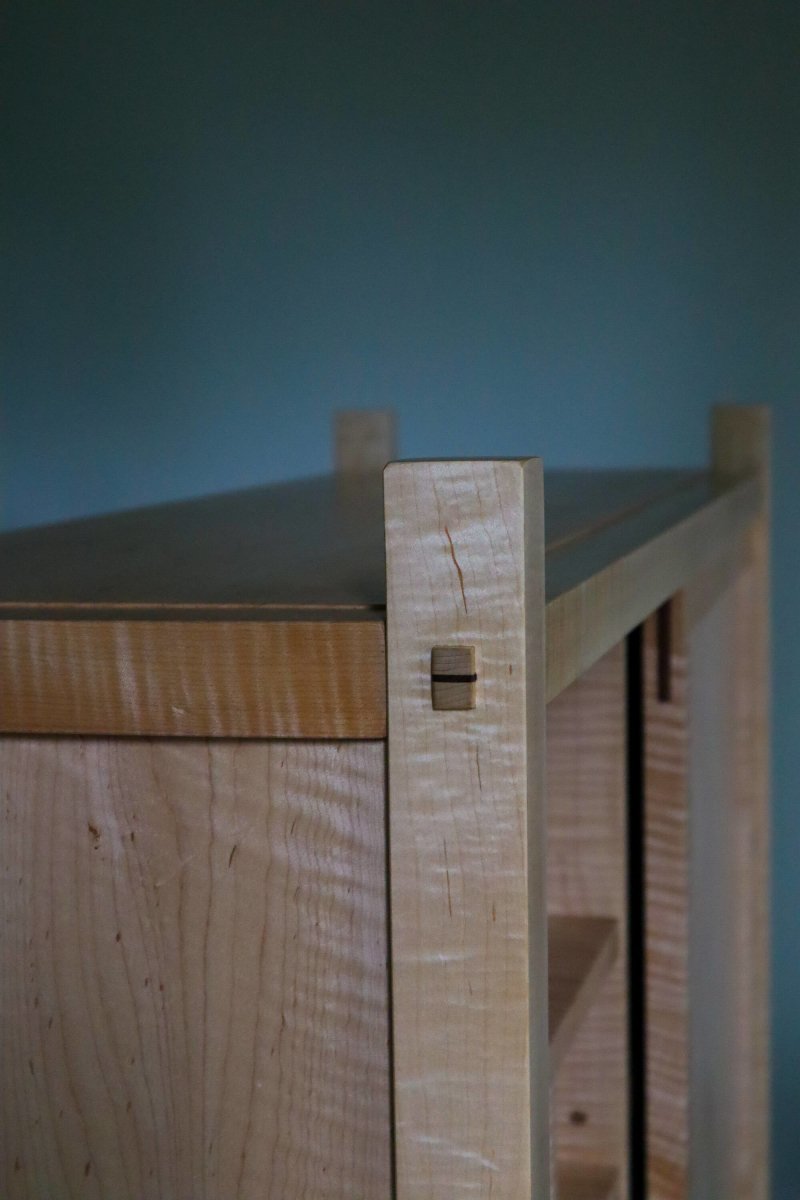 tenon details on a cabinet with sliding door by Mokuzai Furniture