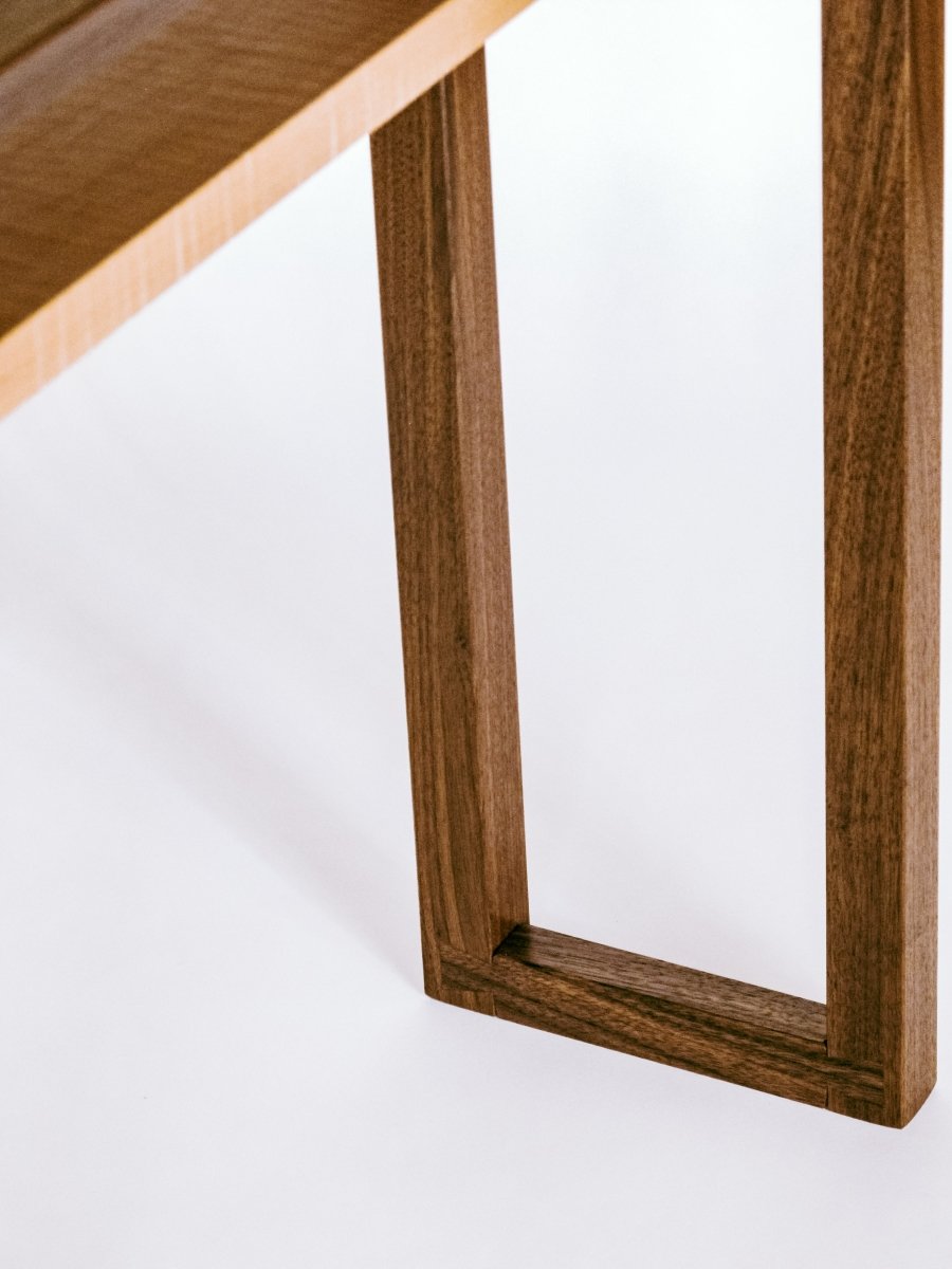 hand-cut dovetail joinery at the feet of this narrow sofa console table